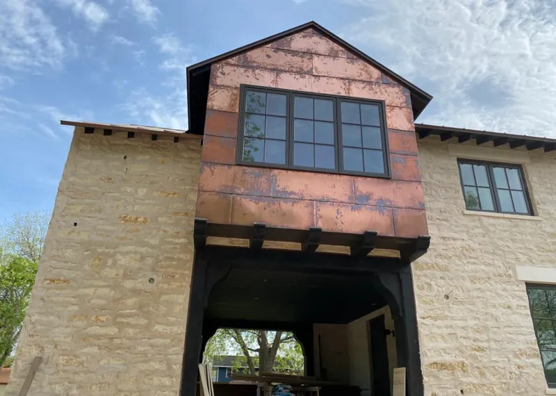 Copper metal panel facade on a stone building for Skylight Installation in Seven Hills